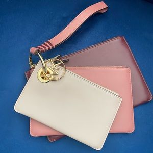 New never used Michael Kors Tri Jet Set Travel pouch.